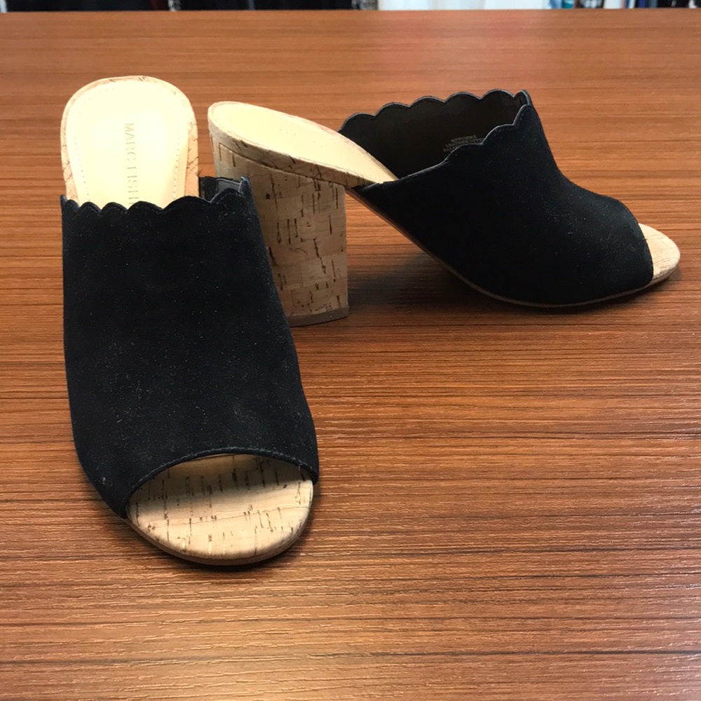 Like new. Black suede sandals with cork heels.